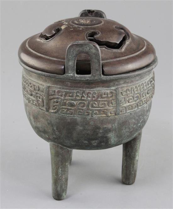 A Chinese archaic bronze tripod ritual food vessel, Ding, Qing dynasty., 17cm high, 14cm wide